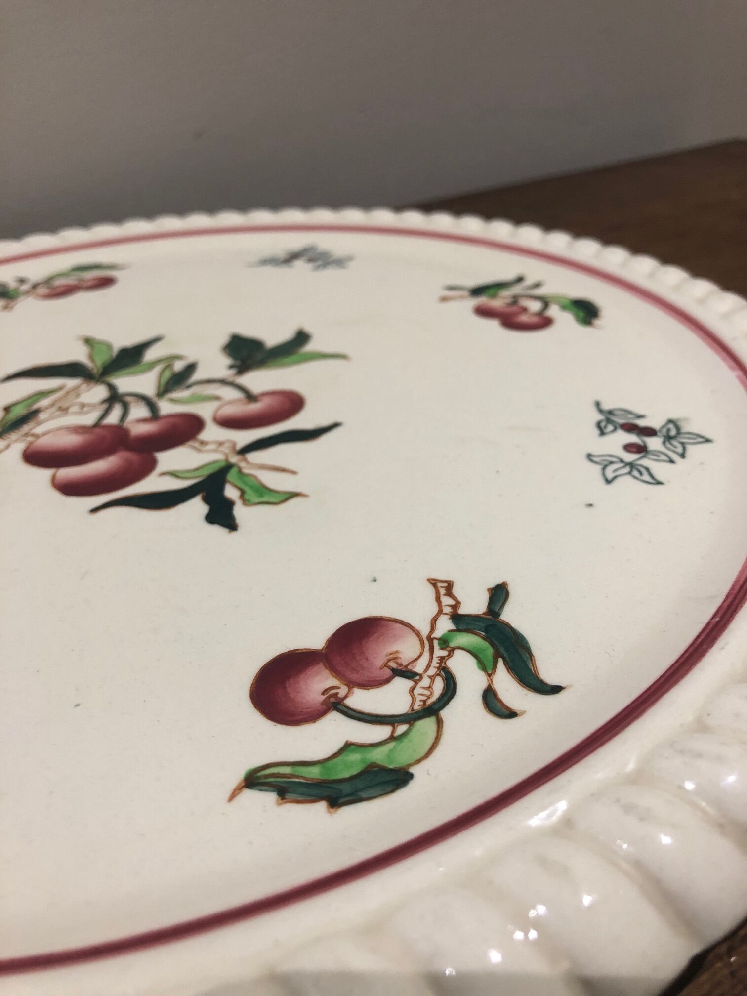 Longwy earthenware dish decorated with cherries