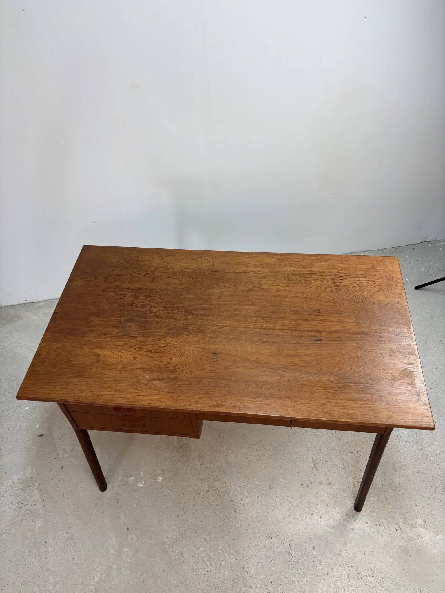 Flat desk in teak with three drawers, Scandinavian work from the 1950s-70s.
