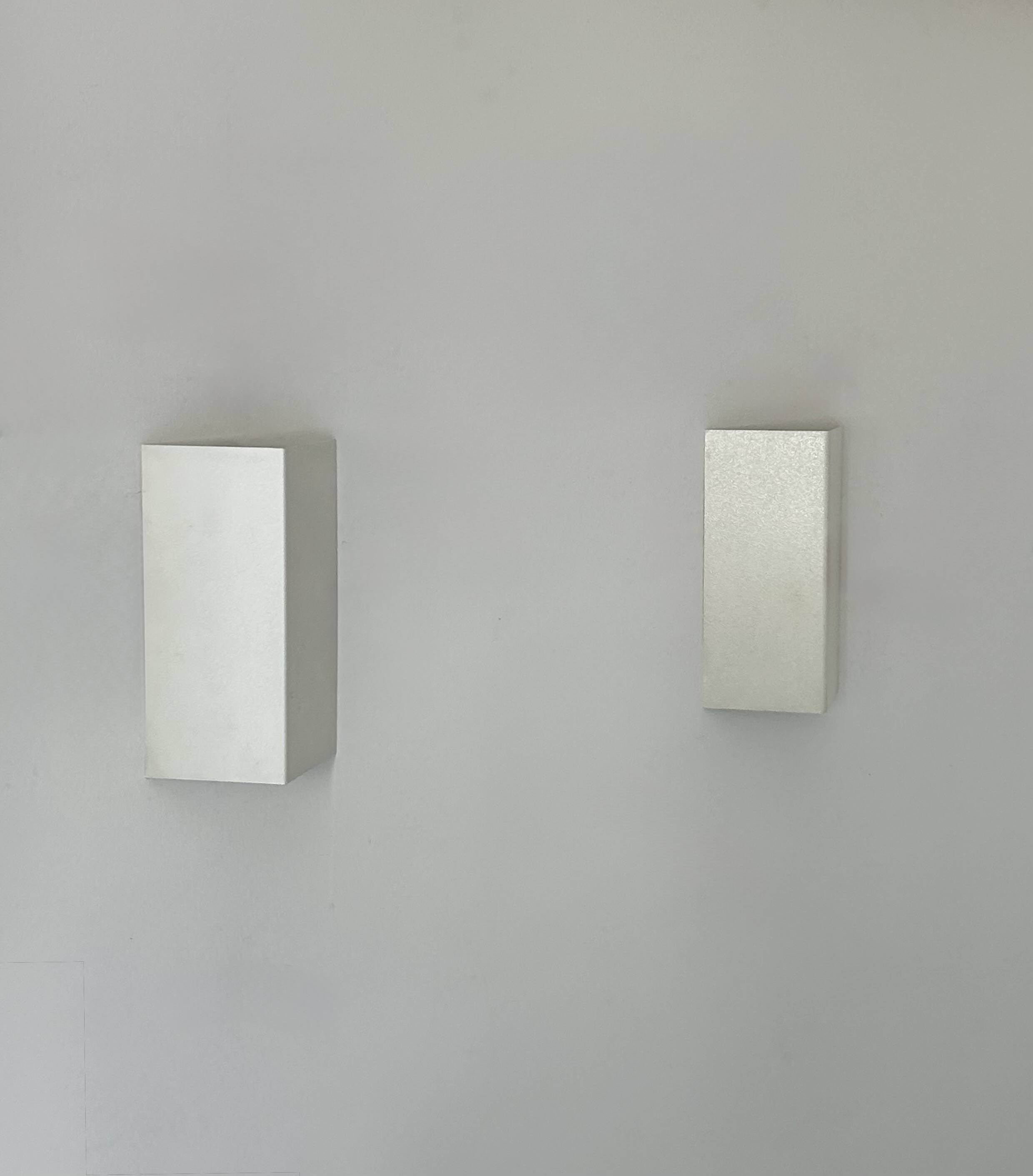 Pair of vintage wall lights, matte white metal, France 1970.
