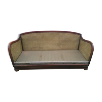 Former caned wood sofa