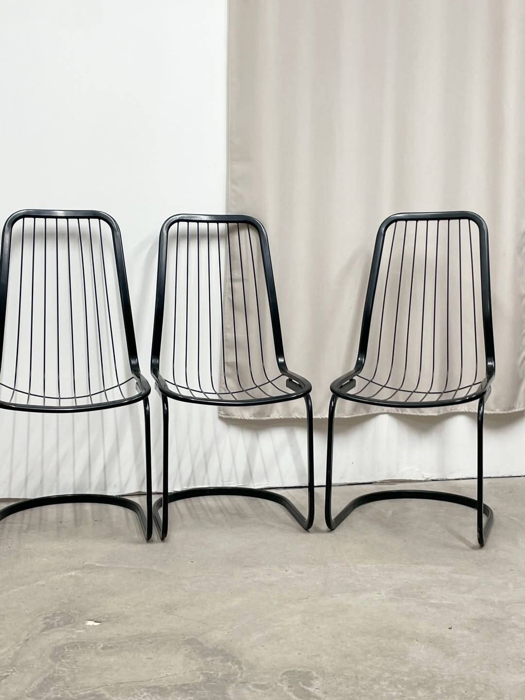 4 black wire metal chairs