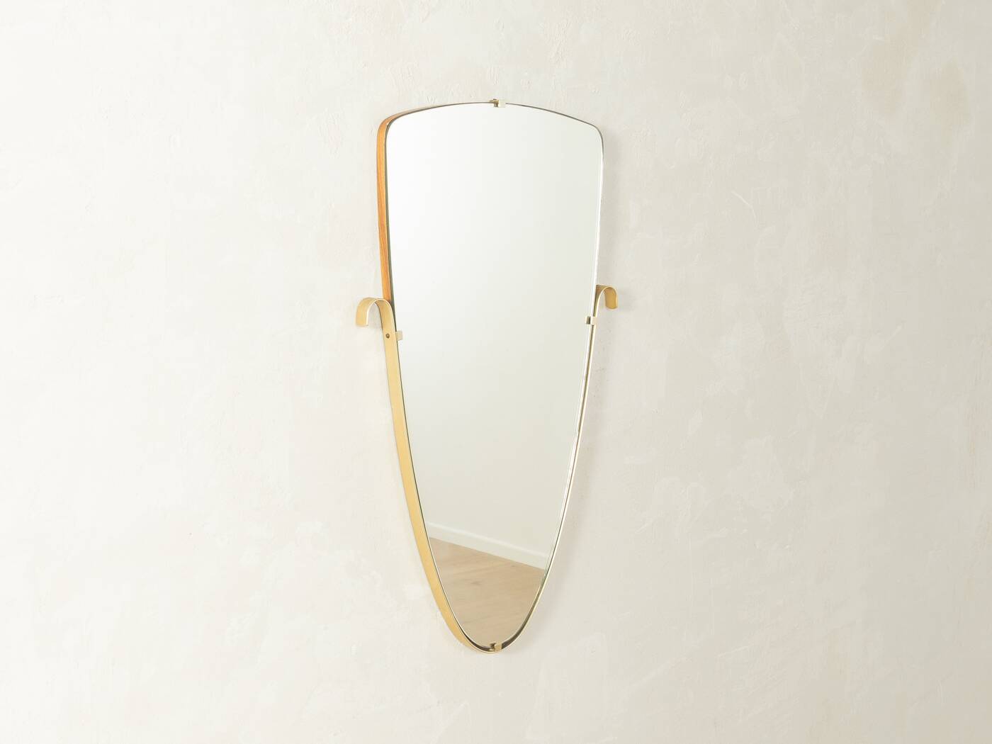 Elegant wall mirror from the 1950s with brass frame