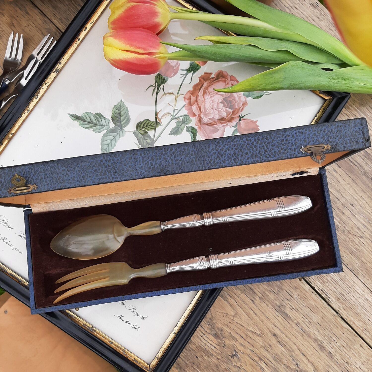 Corn and silver metal salad cutlery