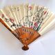 Vintage bamboo fan with floral decoration from China.