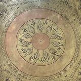 Moroccan coffee table in engraved brass and carved wood