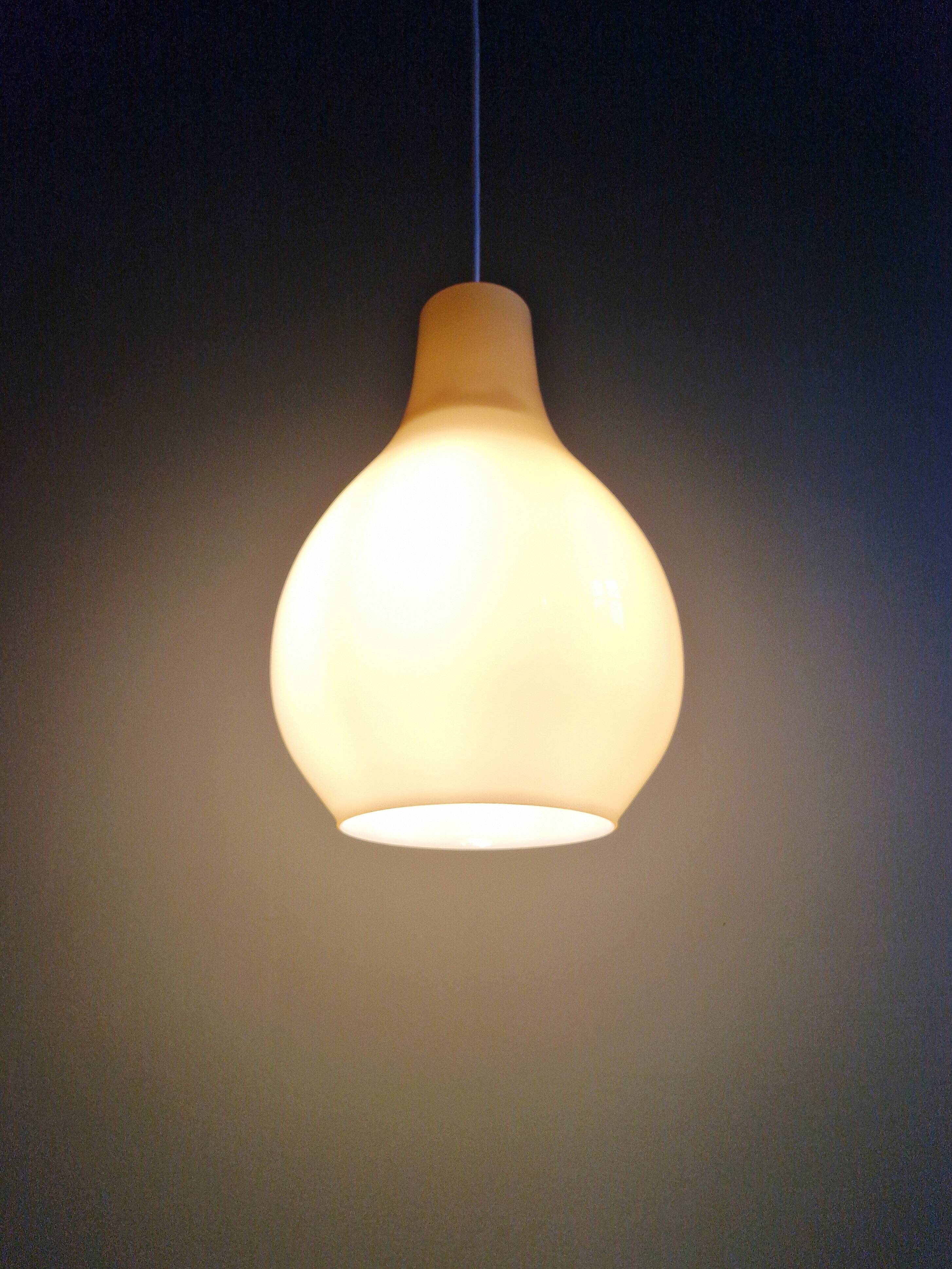 Scandinavian bulbous pendant light in yellow opaline, 1960.