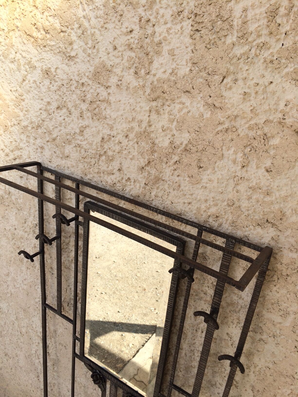 Old Art Deco coat rack in hammered iron