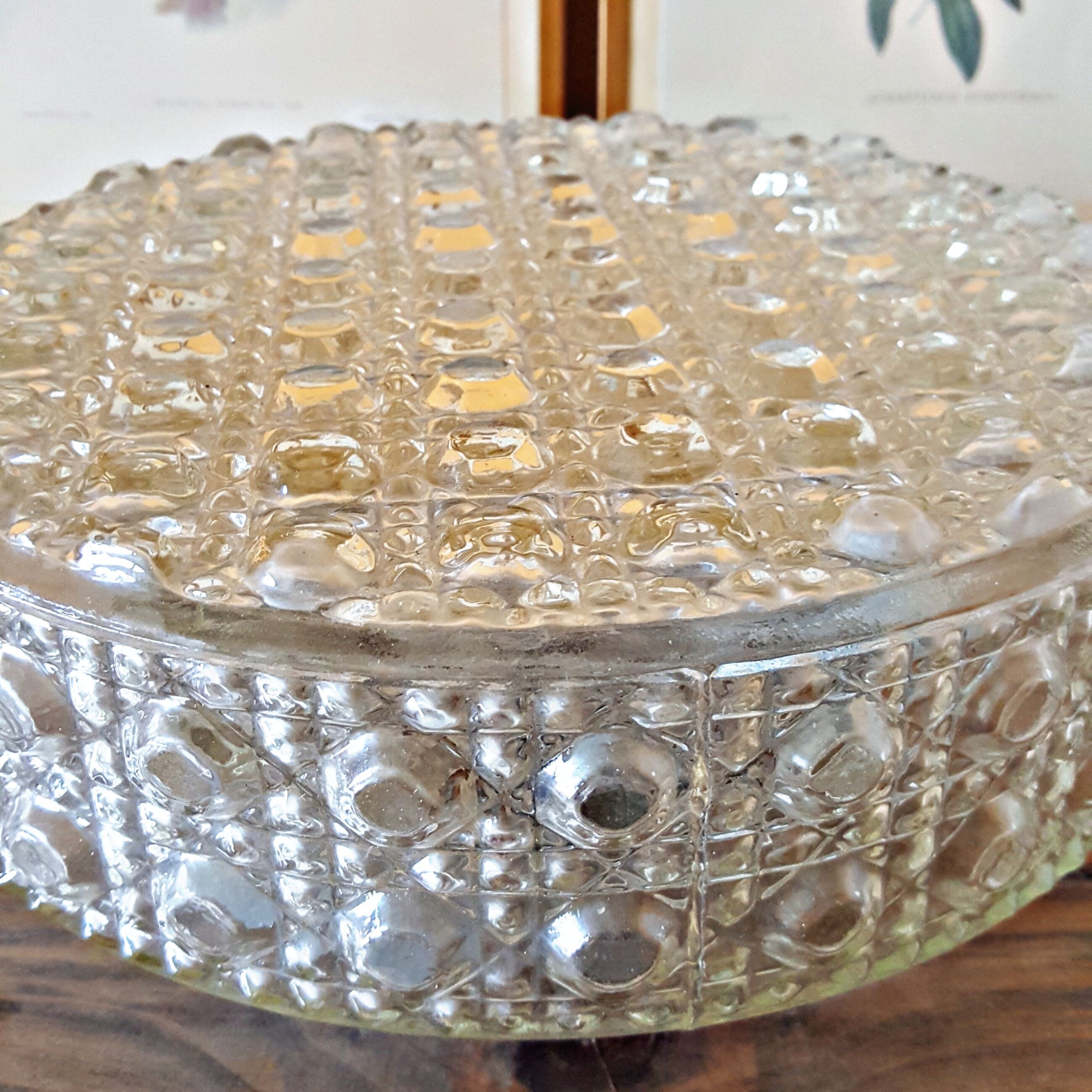 Round vintage wall lamp in transparent molded glass