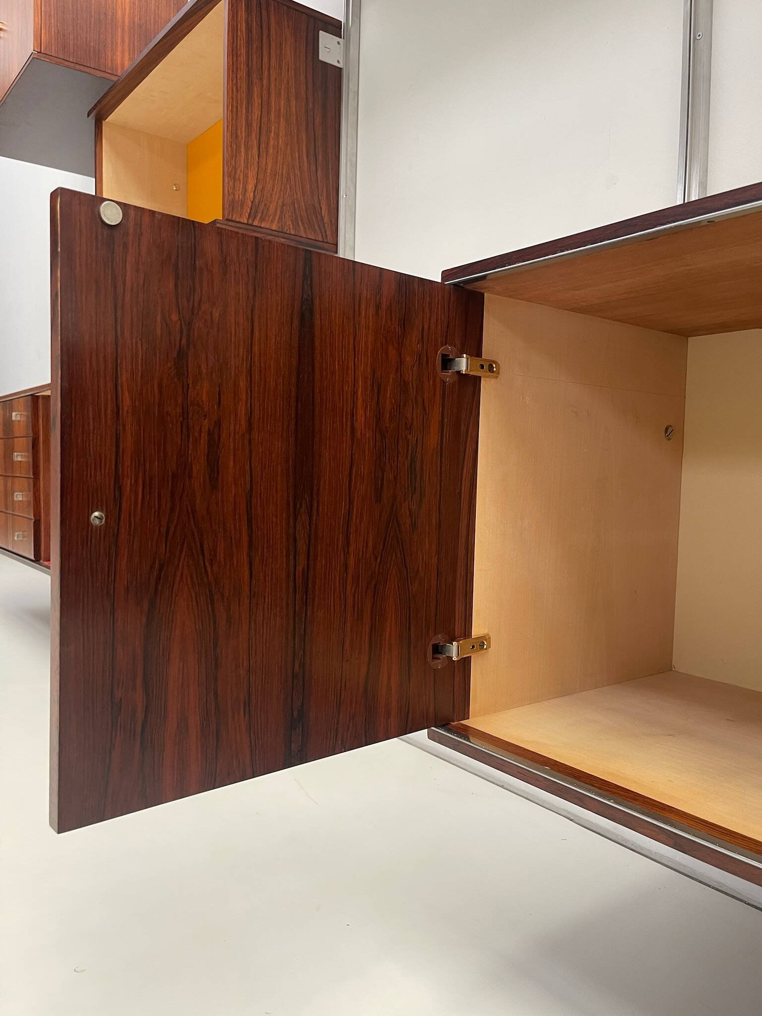 Large colorful wall unit in luxury wood