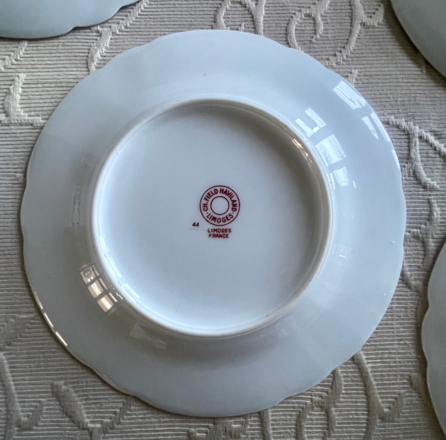 12 Haviland Limoges dessert plates.