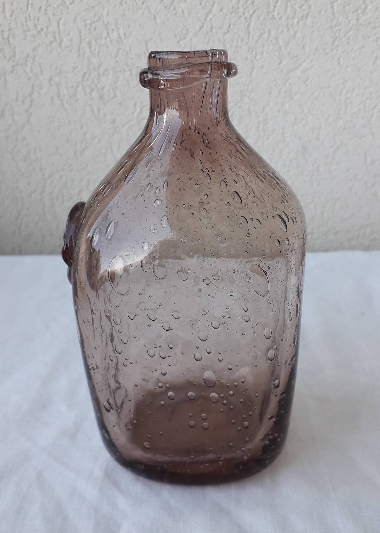 Biot bottle in bubbled glass