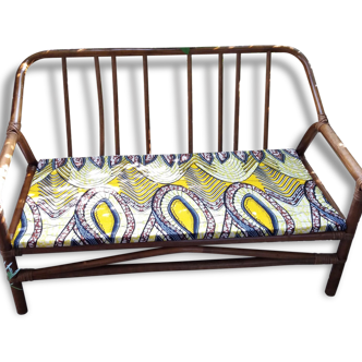 Banquette rotin vintage assise tissu africain wax