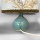 Old small green ceramic side lamp with dried flower lampshade