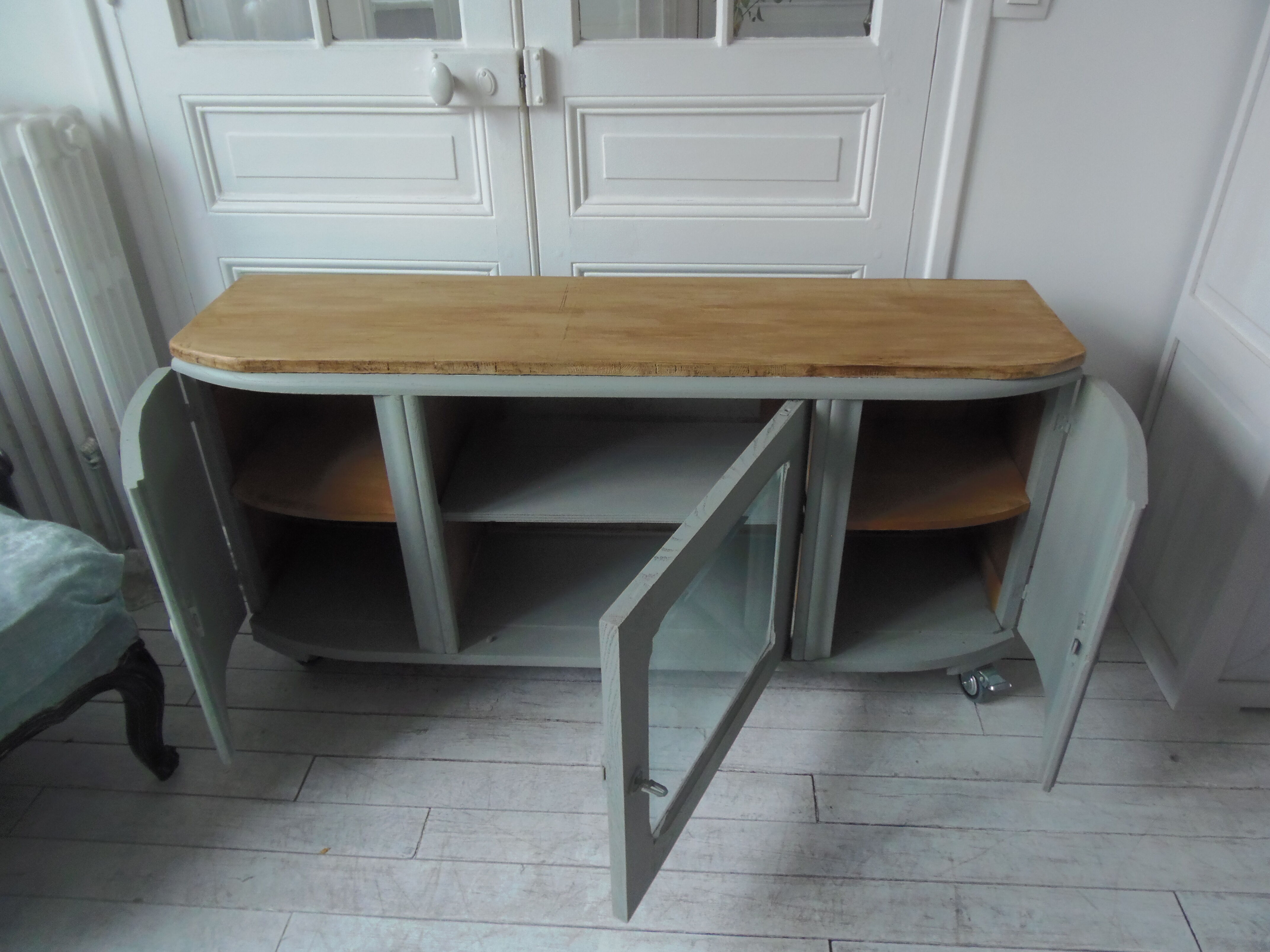 Art Deco furniture revisited in gray green and placed on wheels.