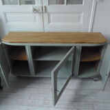 Art Deco furniture revisited in gray green and placed on wheels.
