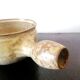 Beige glazed terracotta caquelon