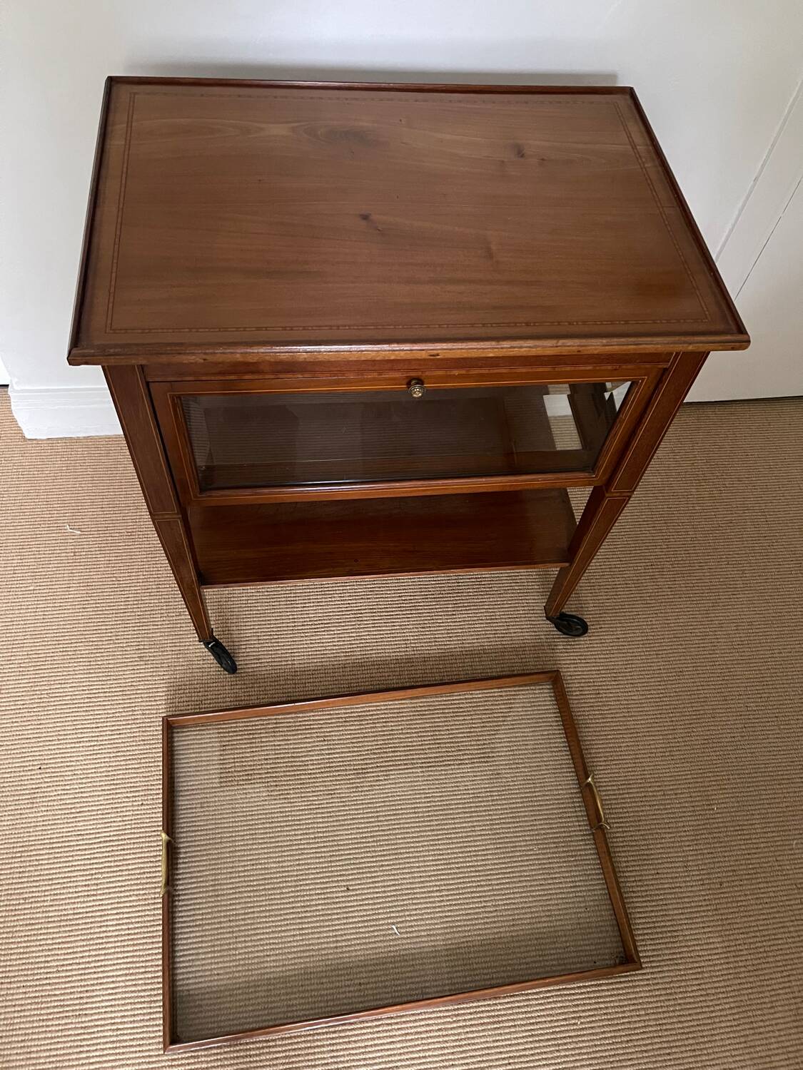 Serving Light mahogany English tea table. Beveled windows. circa 1900. Removable glass top.