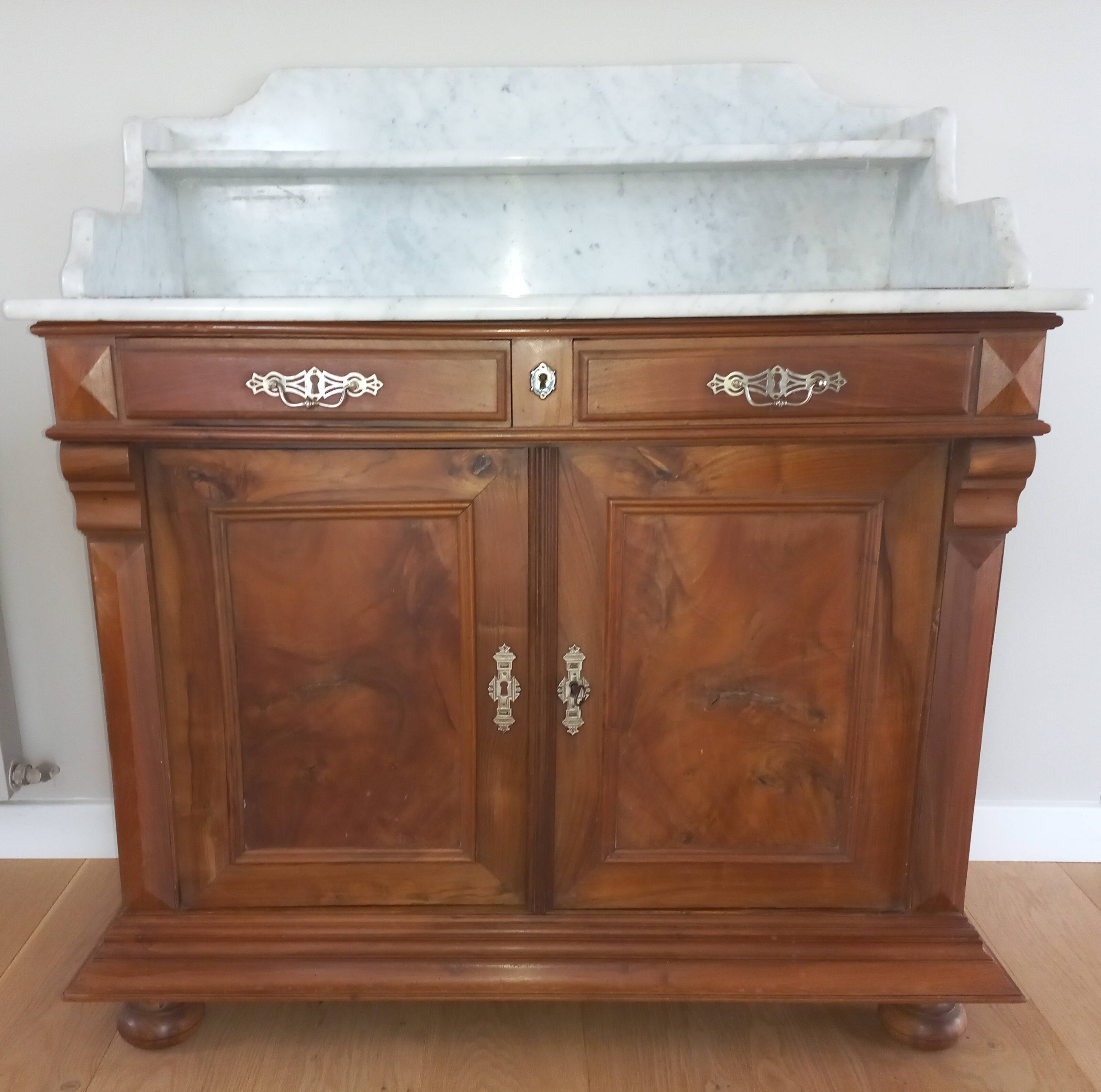 Empire period bathroom furniture in solid walnut and white marble.