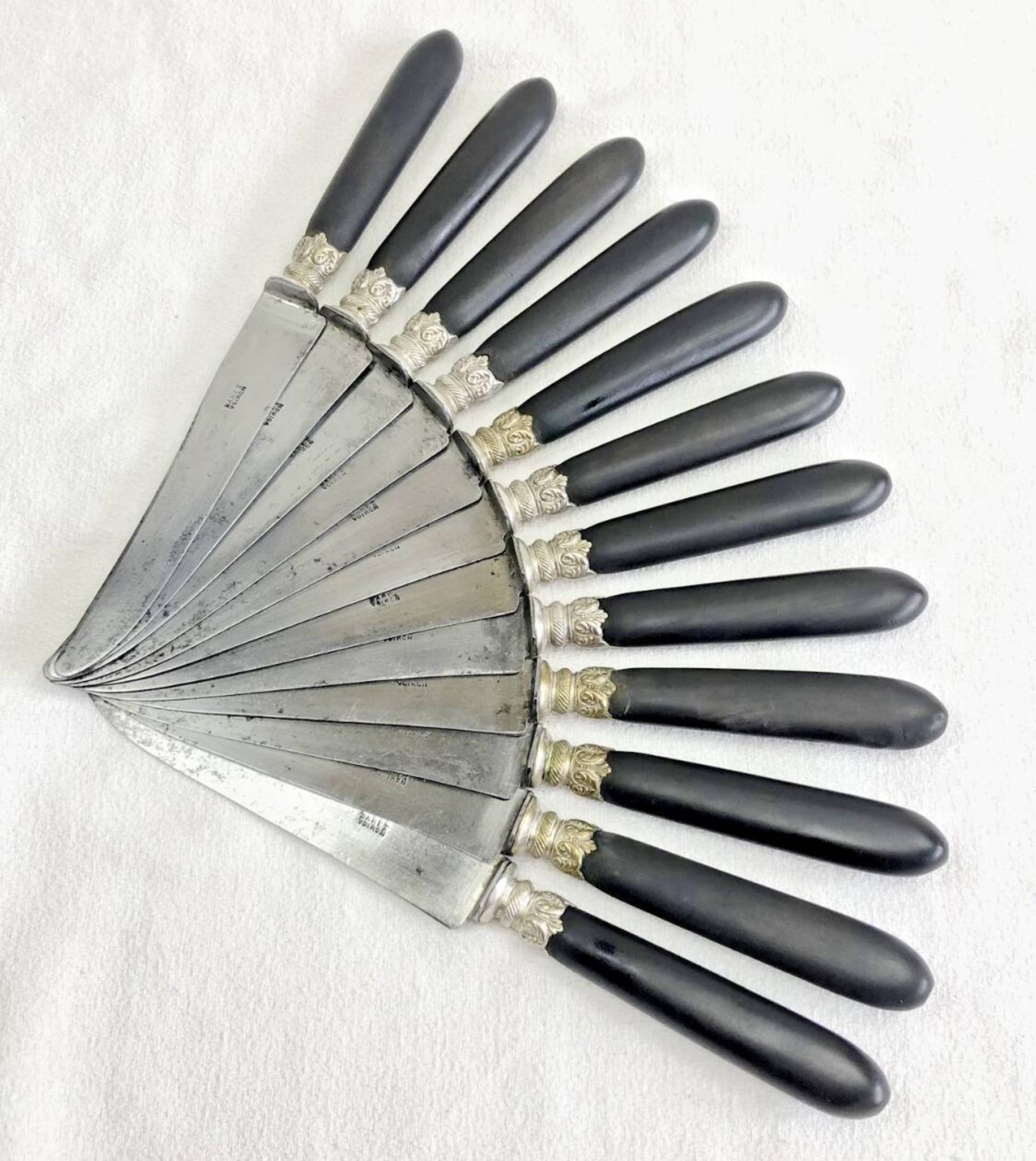 12 antique large table knives with ebony handles from the Napoleonic III period.