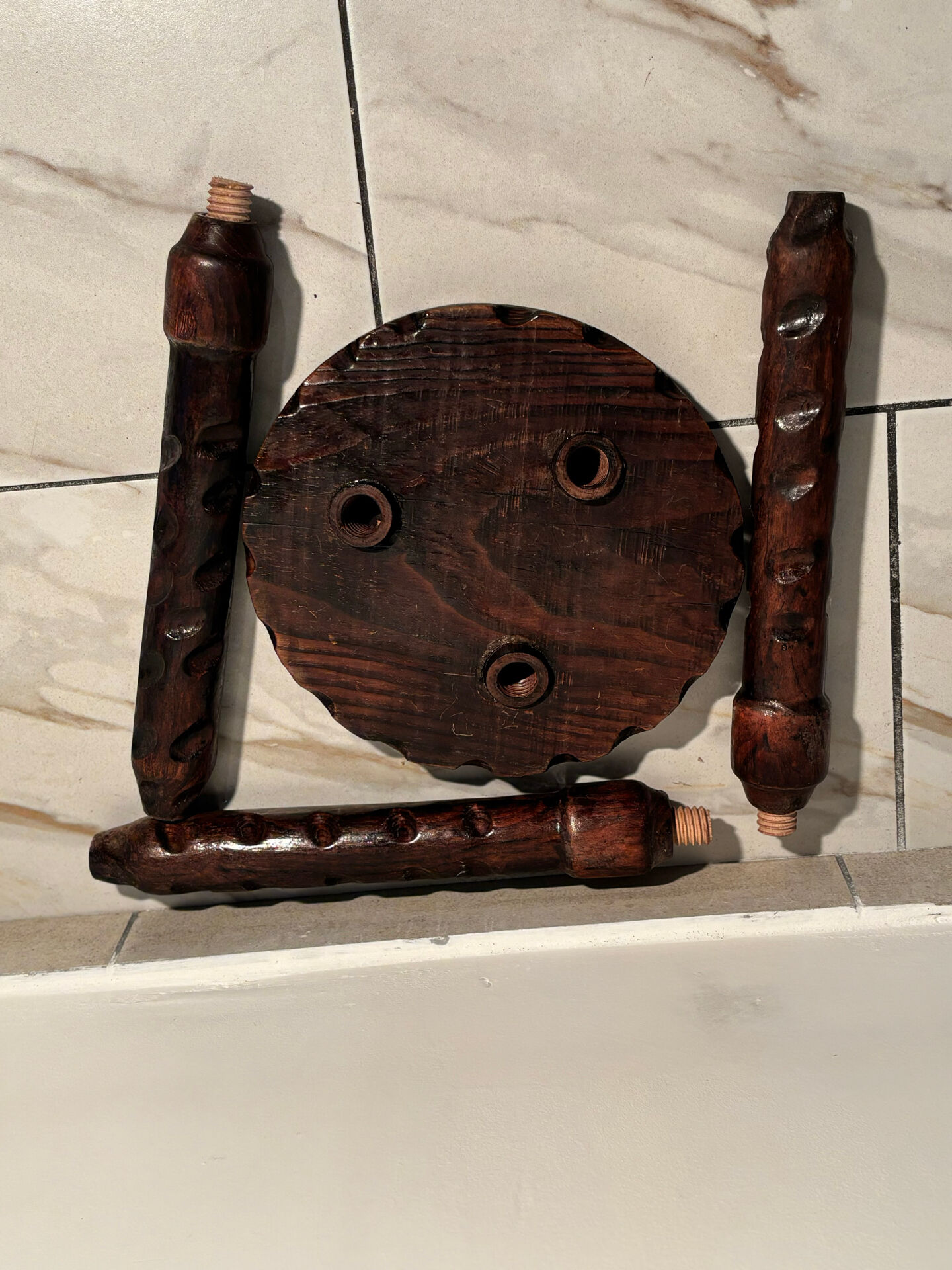 Brutalist sculpted tripod stool in solid wood — 1960s