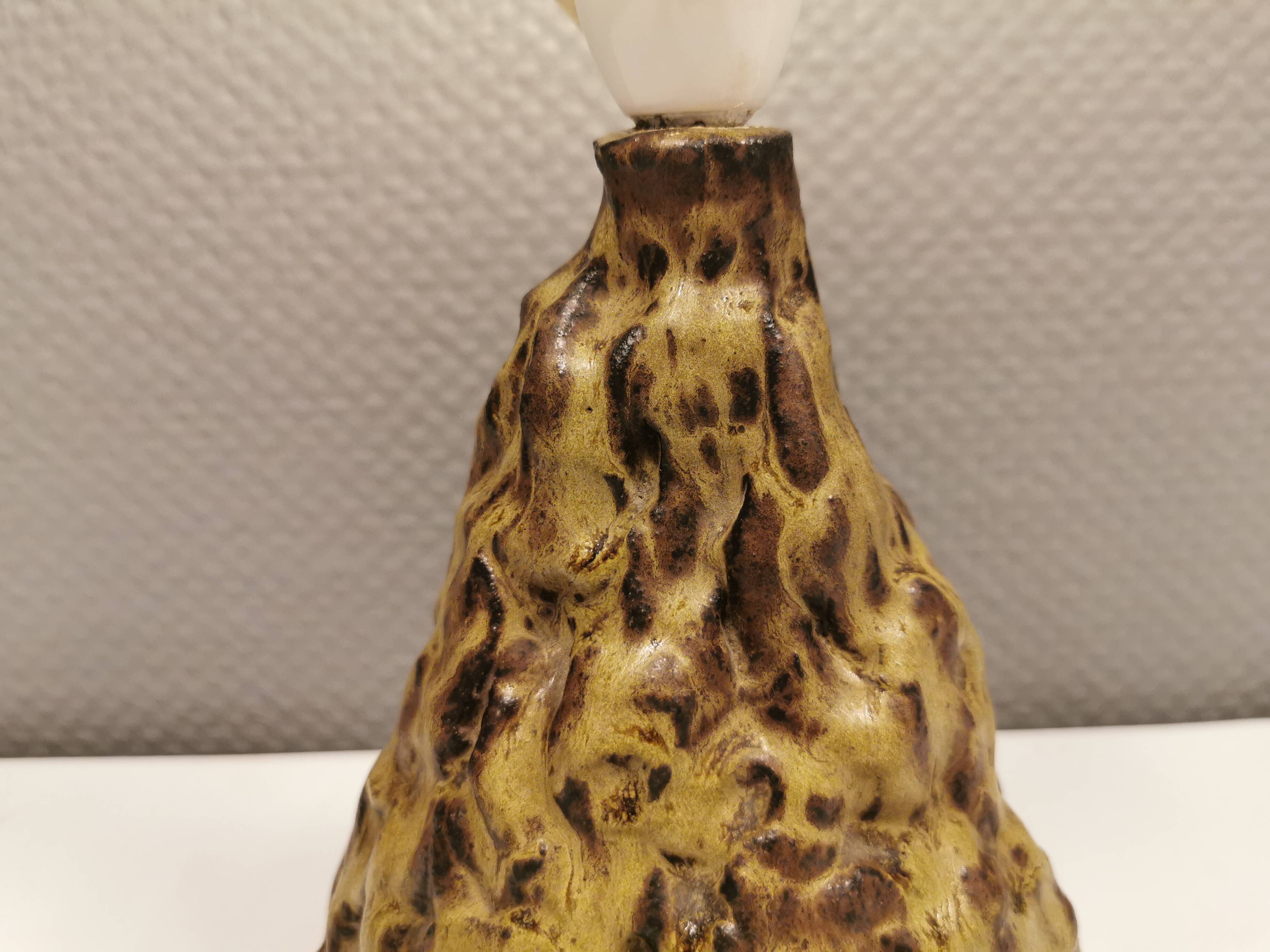 Ceramic table lamp, in greenish/brownish glaze, almost in the shape of a volcano.