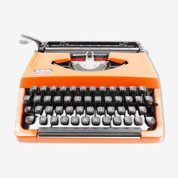 Typewriter Brother 210 orange vintage revised with new Ribbon