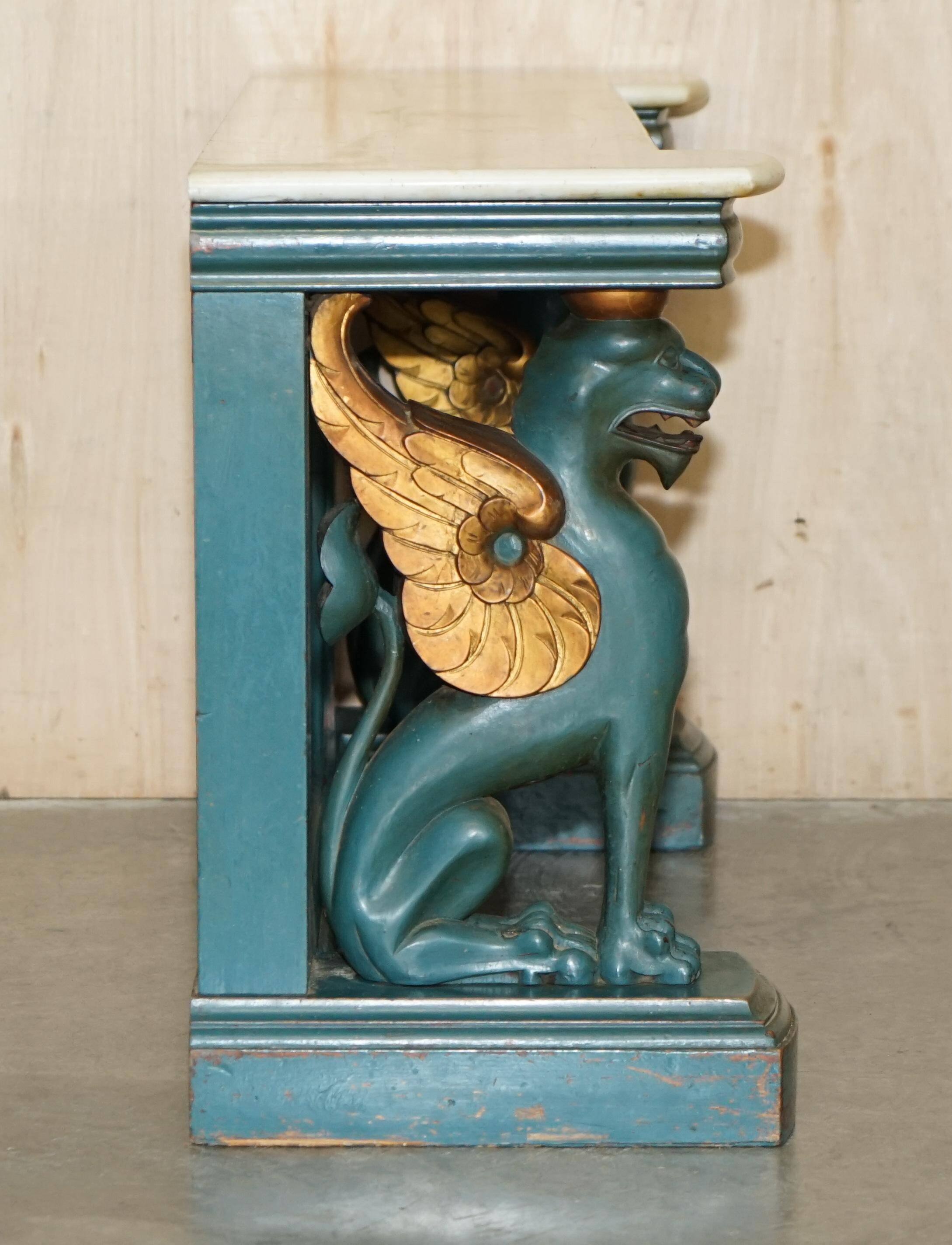 Antique hand-carved console circa 1880 with a marble top.