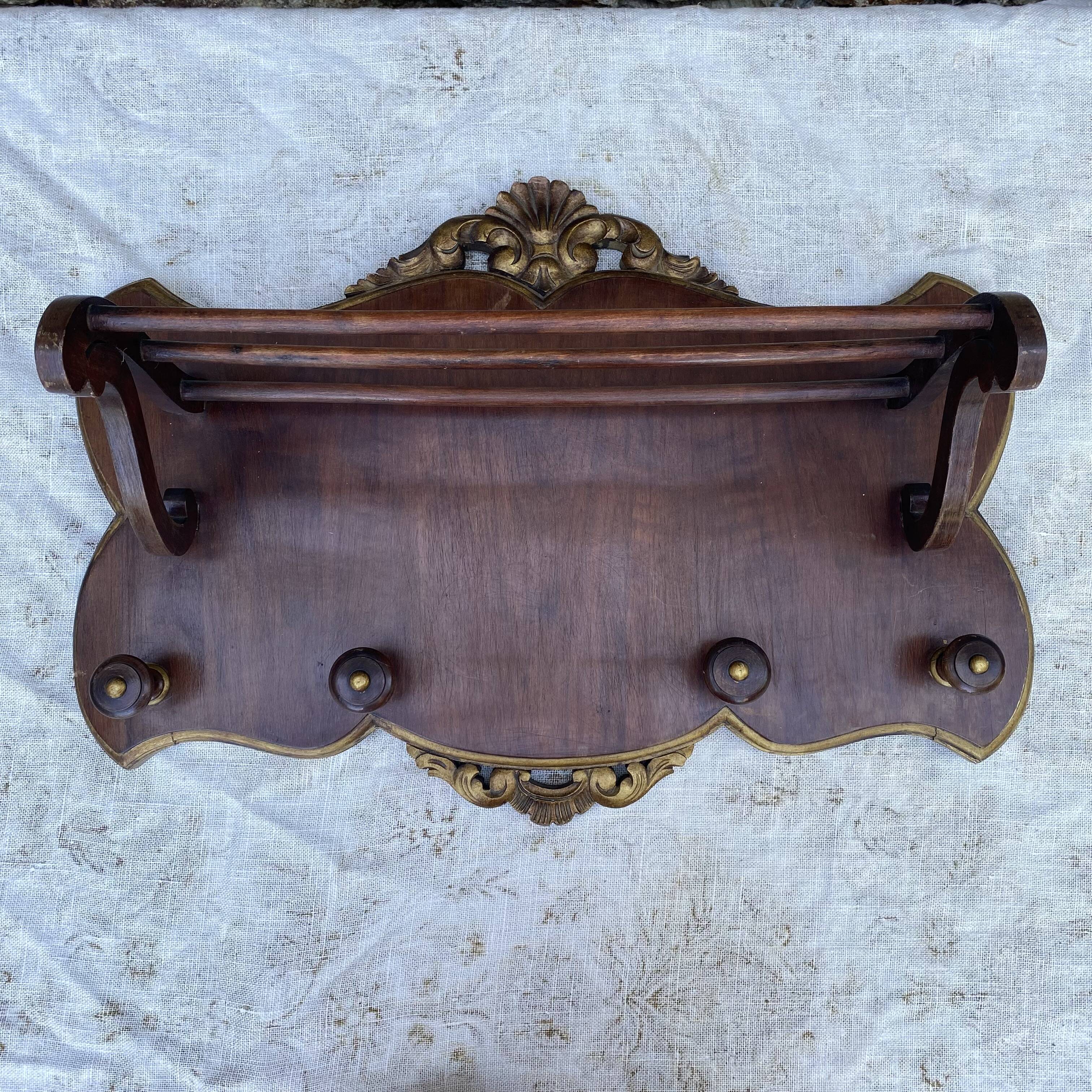 Coat rack and wall-mounted hat rack in an antique style.