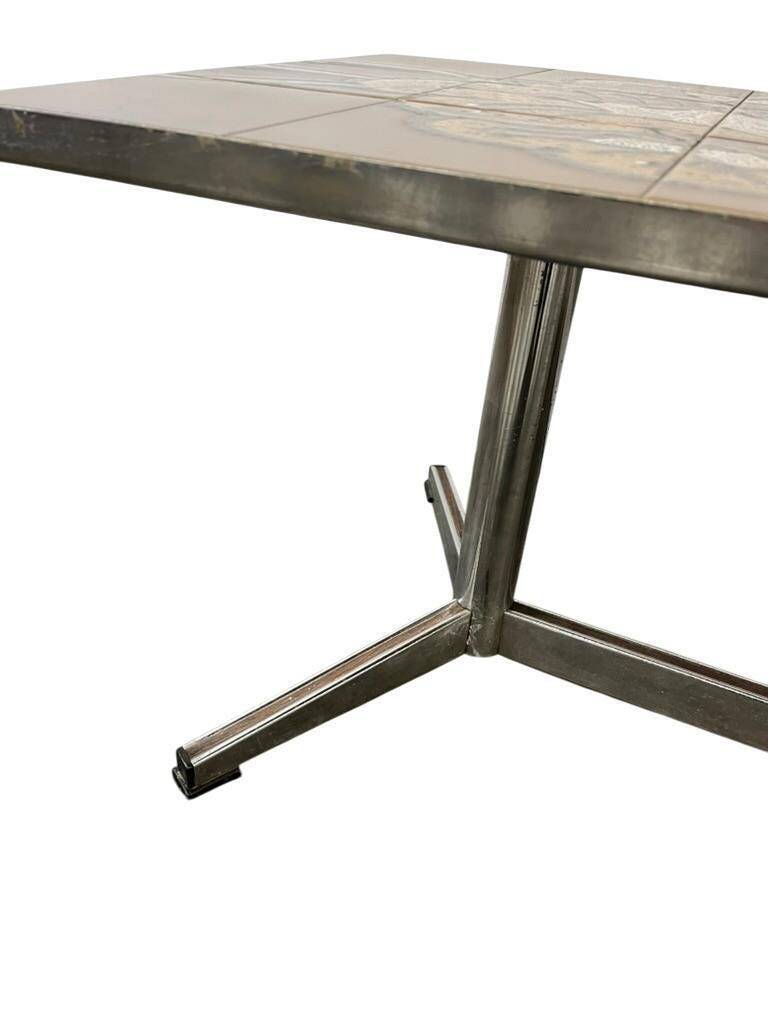 Vintage ceramic coffee table with a chrome frame.