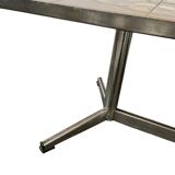 Vintage ceramic coffee table with a chrome frame.