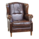 Wing chair made of sheepskin and neatly finished with black piping
