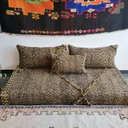 Moroccan sofa on the floor – black and gold pattern