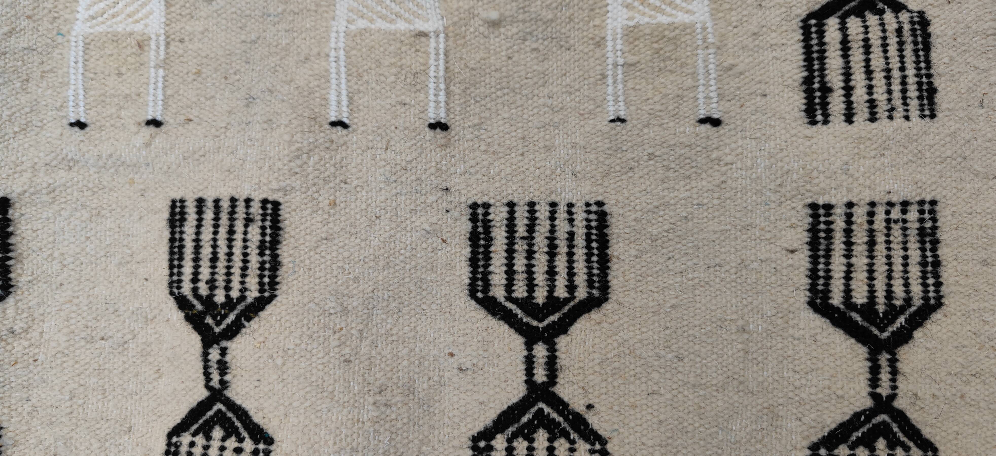 Handwoven kilim rug in natural wool