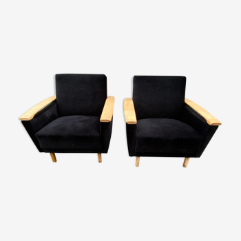 Pairs of black armchairs