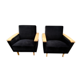 Pairs of black armchairs