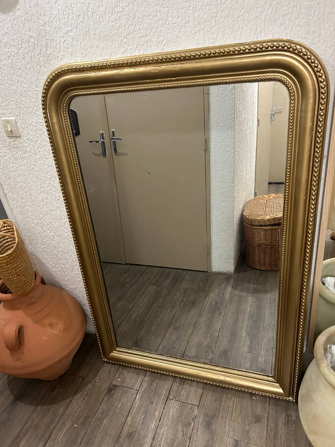 Antique gilded mirror in old Louis Philippe wood