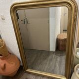 Antique gilded mirror in old Louis Philippe wood