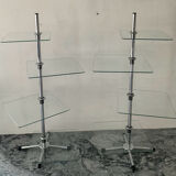 A pair of vintage side tables in glass and chrome metal.