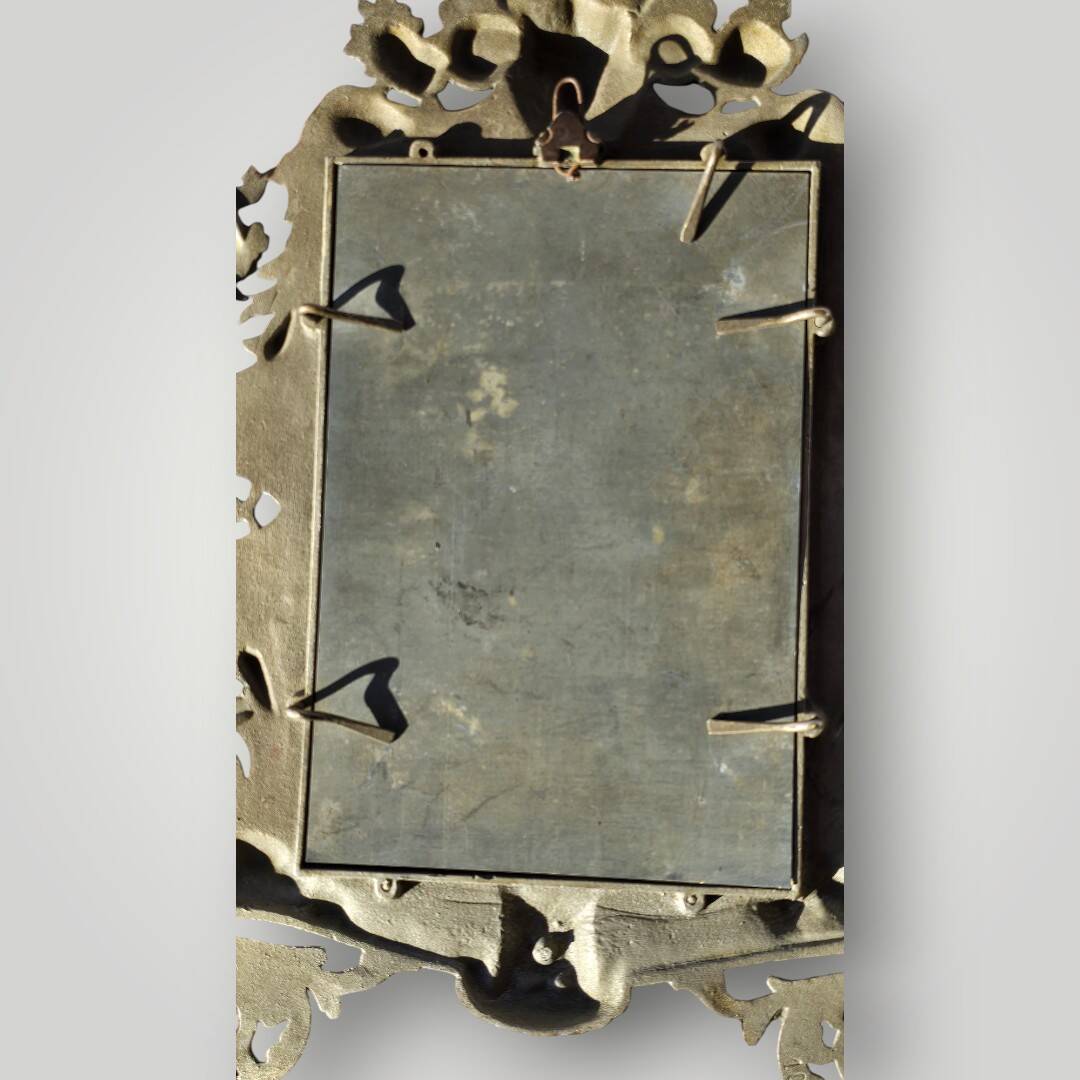 Gilded bronze wall mirror, beveled glass
