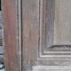 Oak entrance door and its frame and transom, wrought iron gates