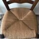 Wooden and straw chairs