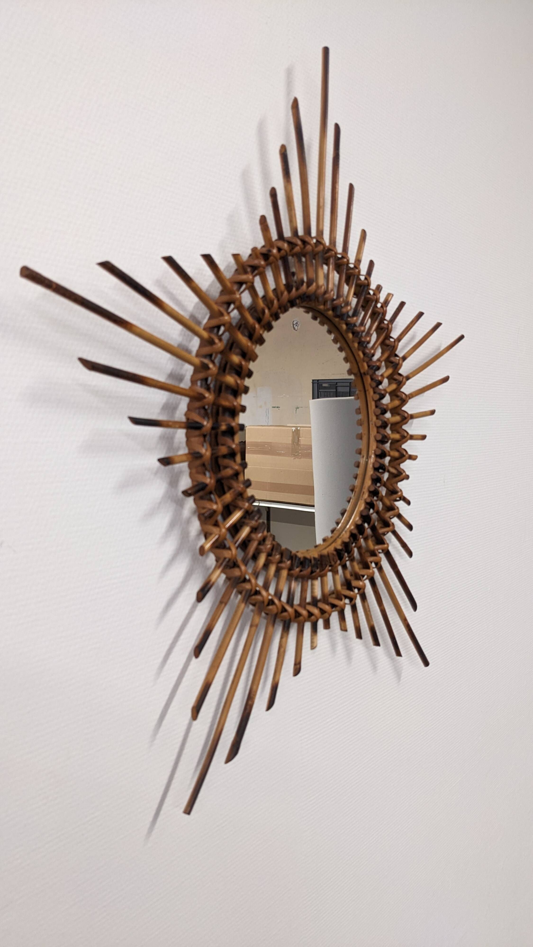 Starry sun mirror in rattan, France around 1960.