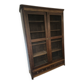 Library in marquetry with a grille from the Louis XVI period.