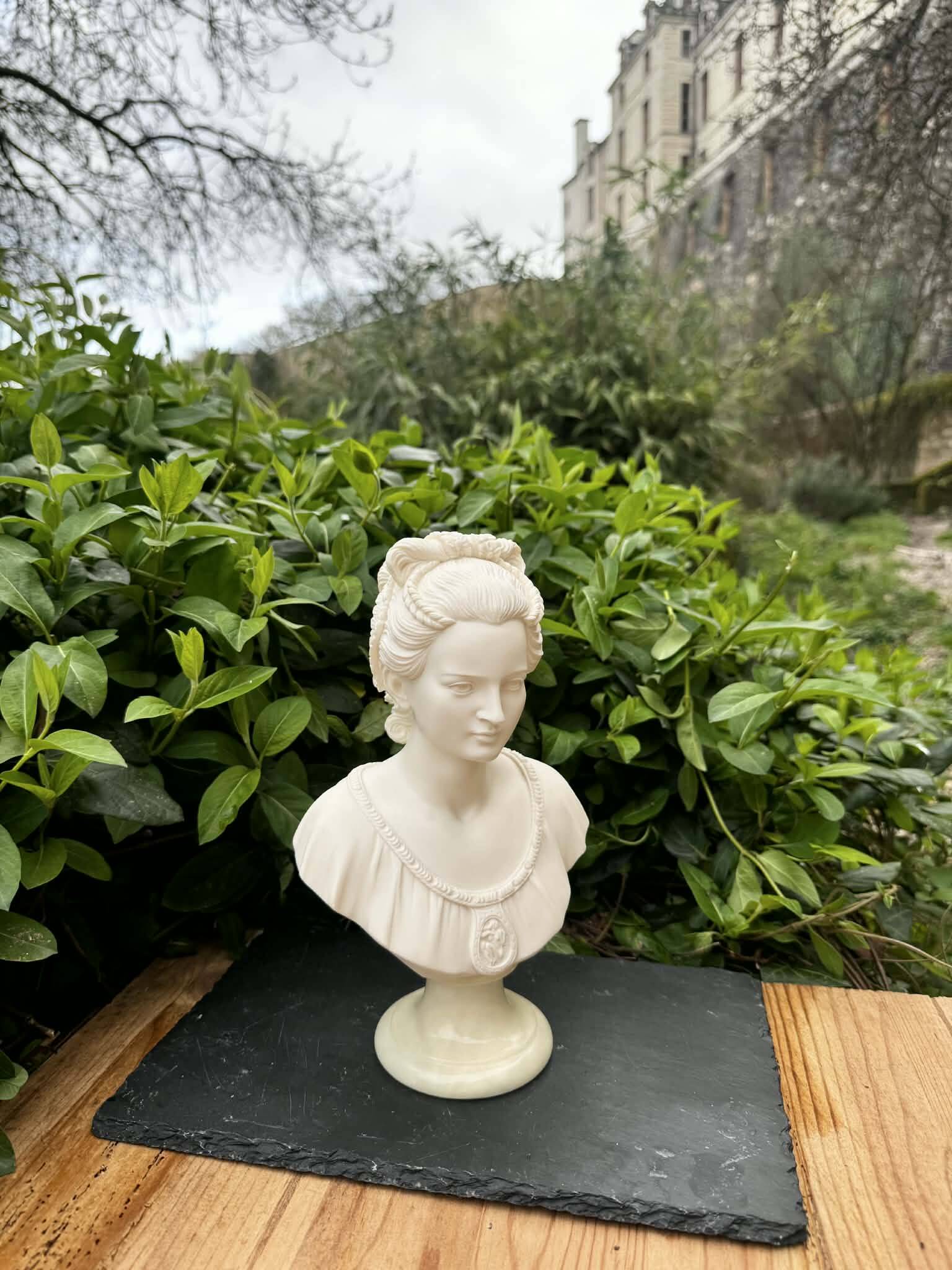 Alabaster bust of a woman signed Arnaldo Giannelli dated 1980.