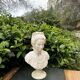 Alabaster bust of a woman signed Arnaldo Giannelli dated 1980.