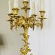 Massive gilded bronze chandeliers from the mid-20th century with marble bases.