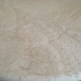 Round bass table in travertine