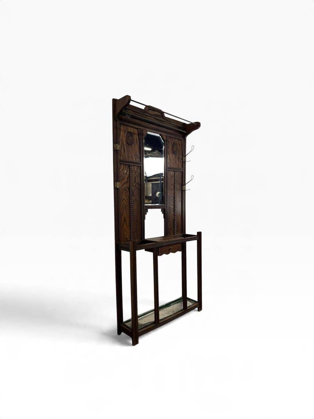 Vintage wooden coat rack with mirror.