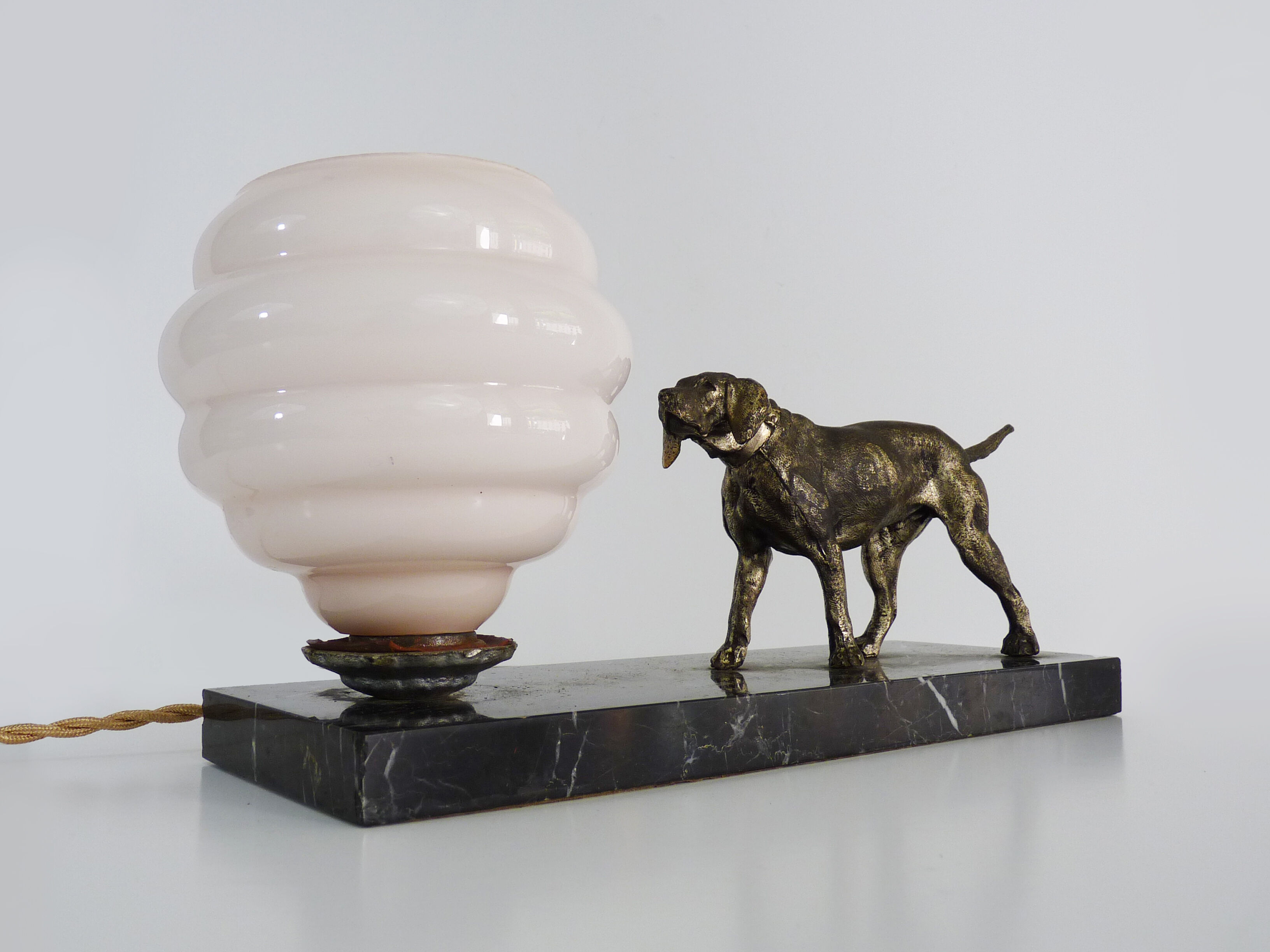 Lamp, Art Deco night light, dog on black marble base, pink globe. Year 30