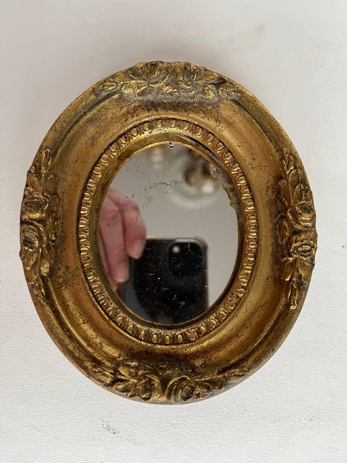 Small old mirror in gilded wood